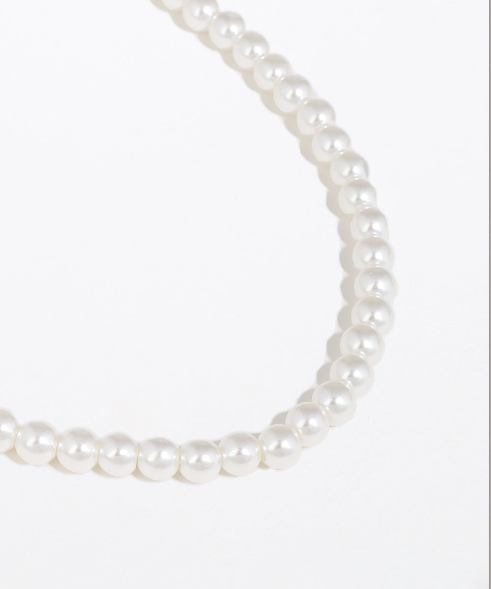Pearl necklace on a white background