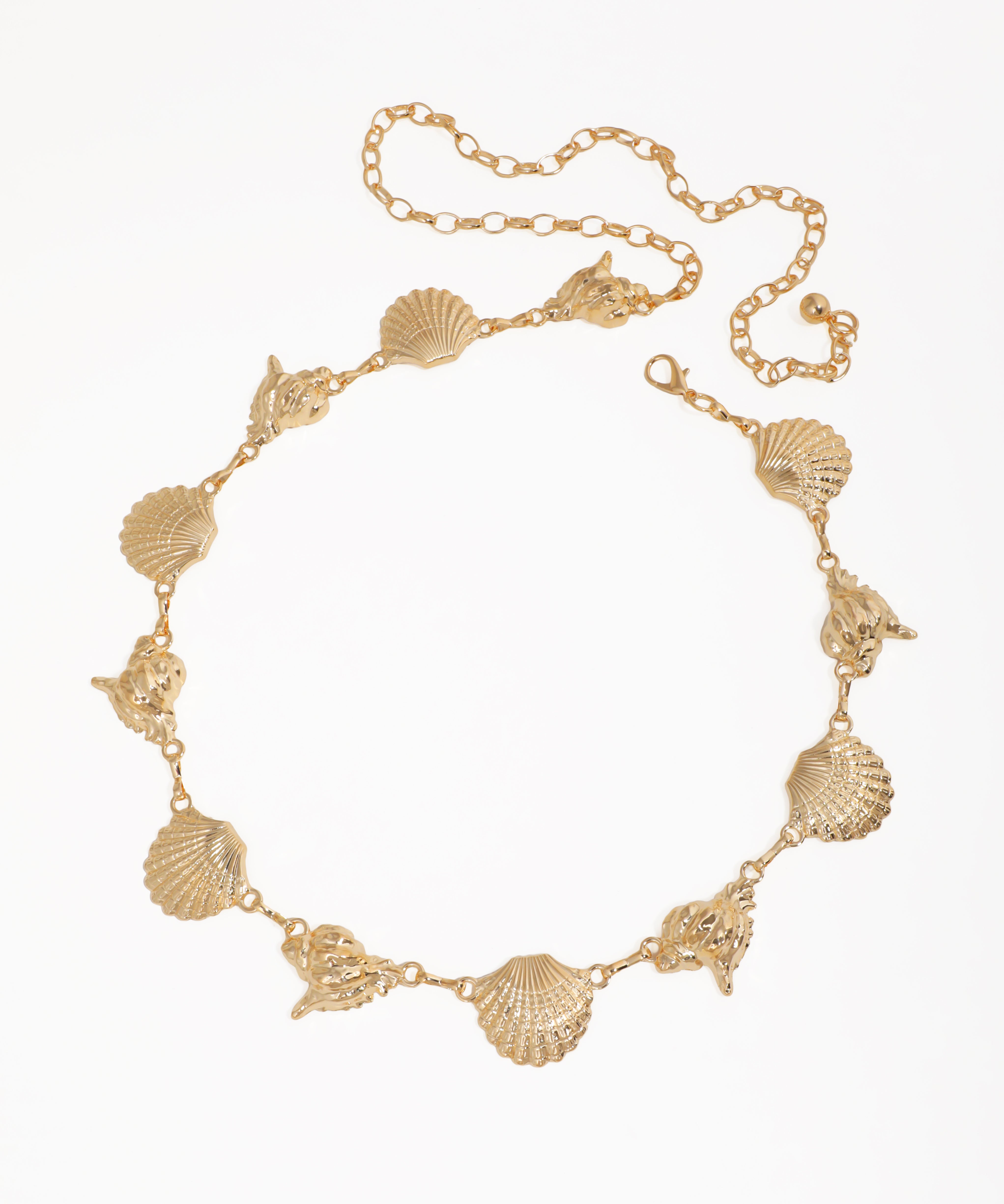 Gold-tone waist chains with textured seashell and conch shell motifs, lobster clasp.