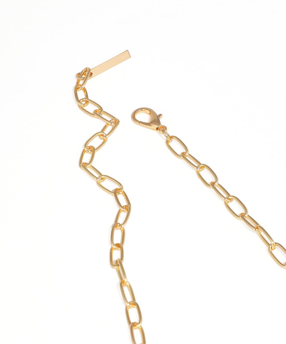 Gold chain necklace on a white background