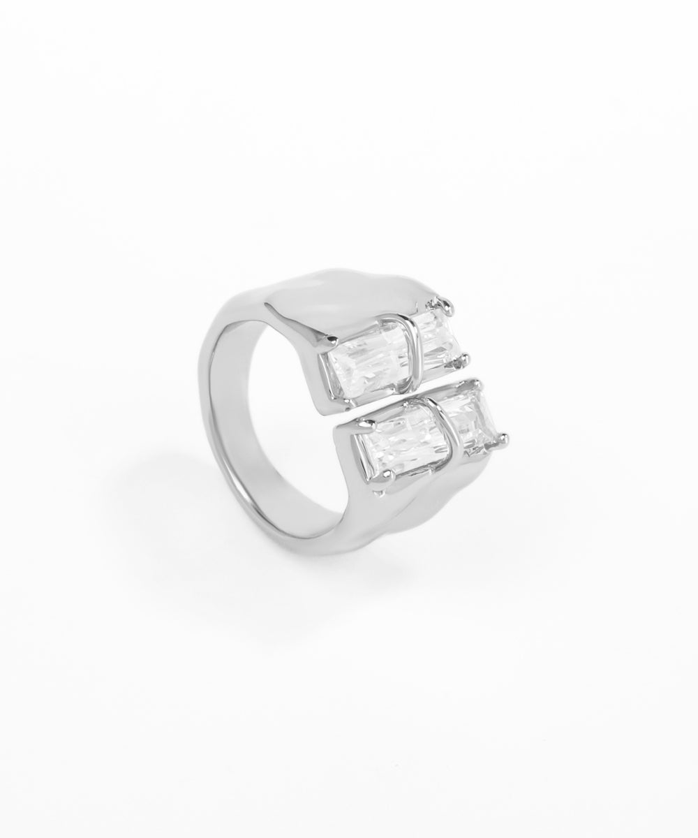 Silver ring with rectangular gemstones on a white background