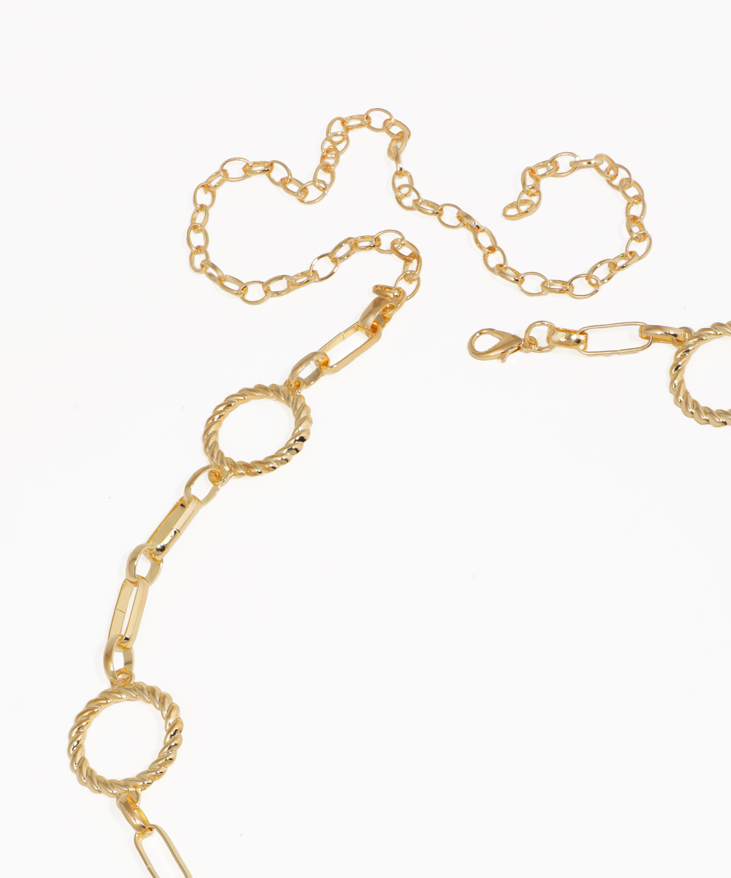 Gold chain necklace on a white background