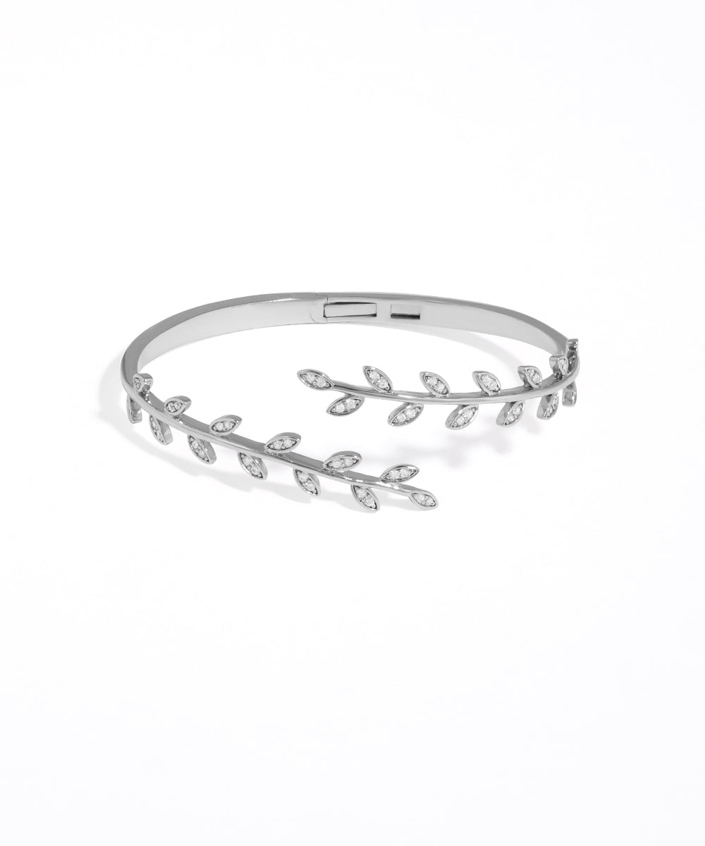 Silver bracelet with leaf design on a white background