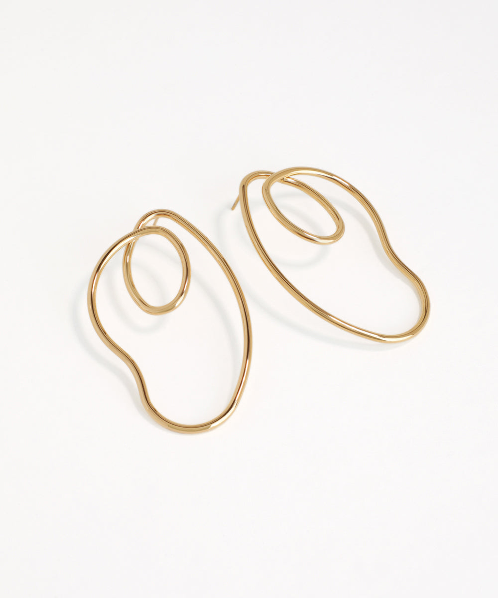 Gold hoop earrings on a white background