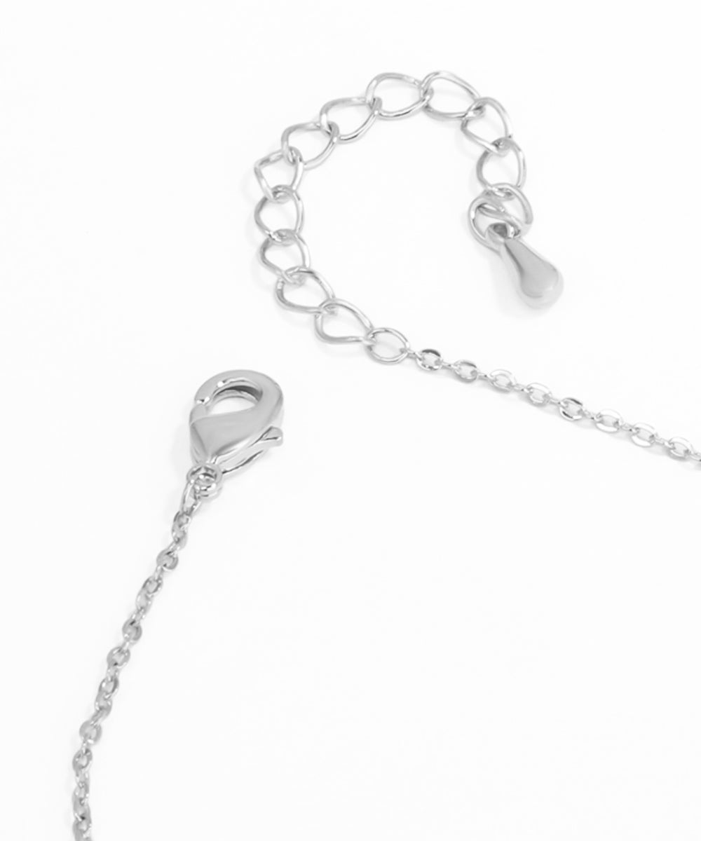 Close-up of a silver bracelet with clasp on a white background