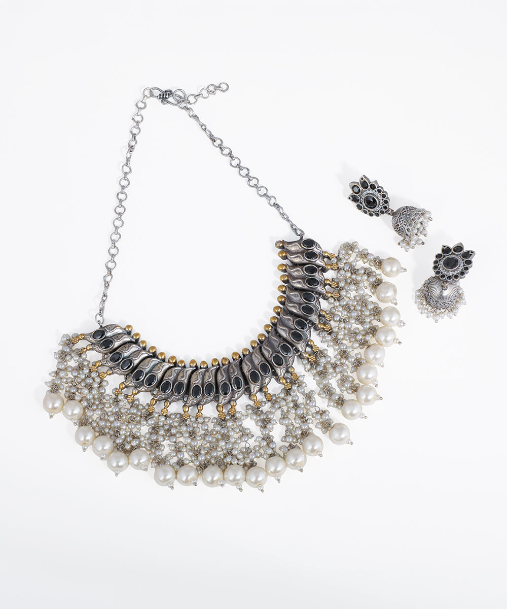 Oxidized silver-tone sculpted choker necklace set with black glass stones and faux pearls