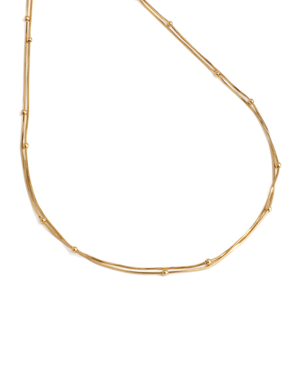 Gold necklace on a white background