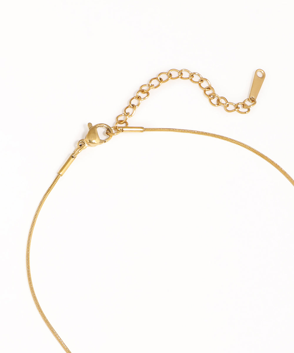 Gold bracelet on a white background