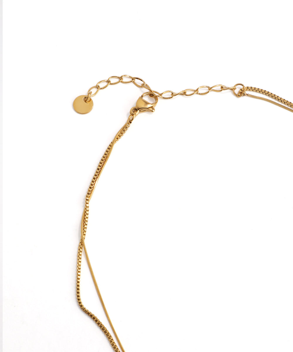 Gold bracelet on a white background