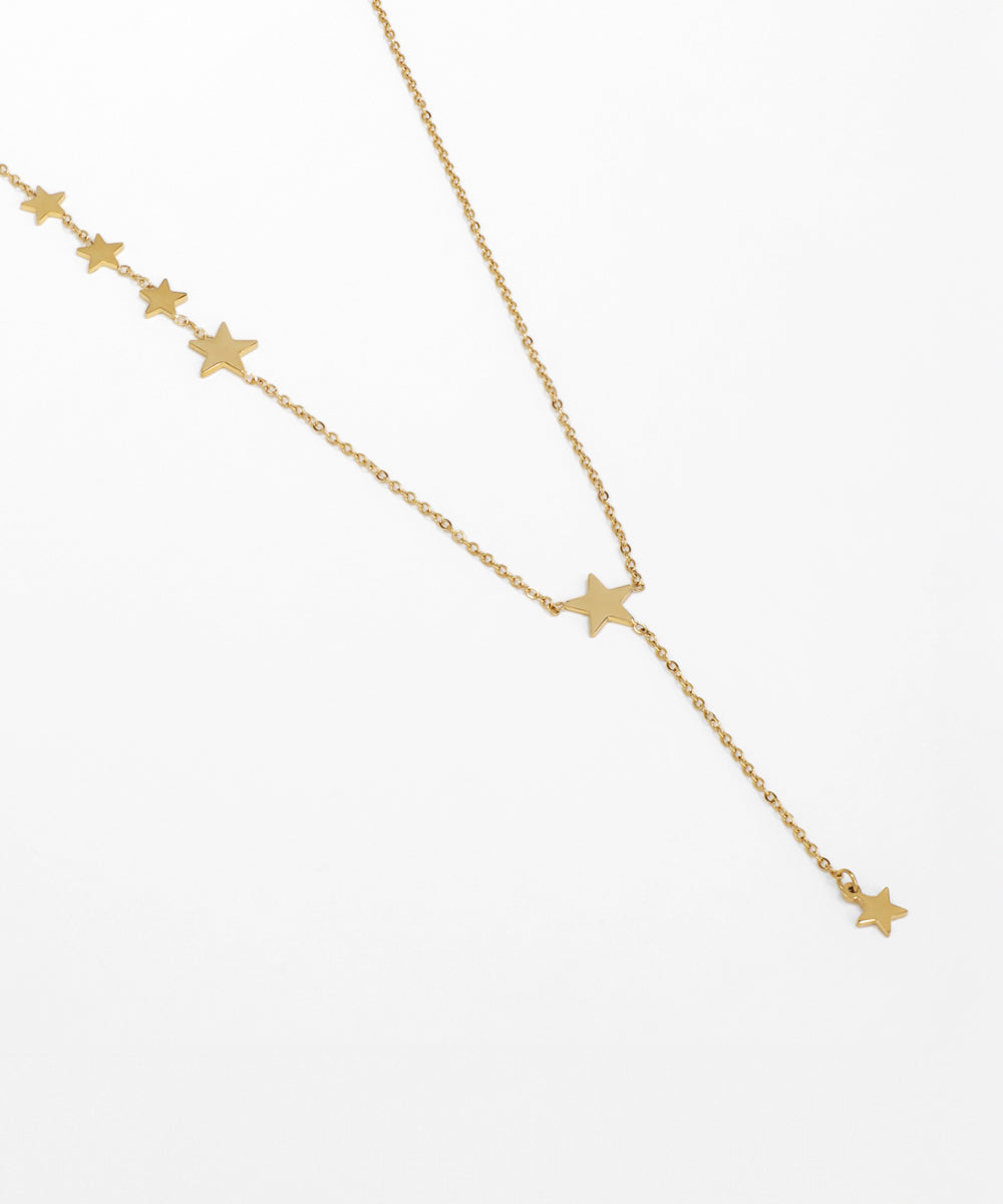 Gold necklace with star pendants on a white background