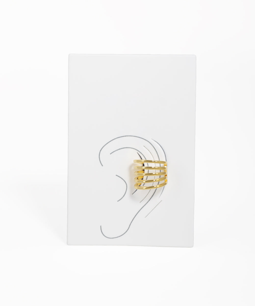 Gold ring earring displayed on a white card with an ear illustration.