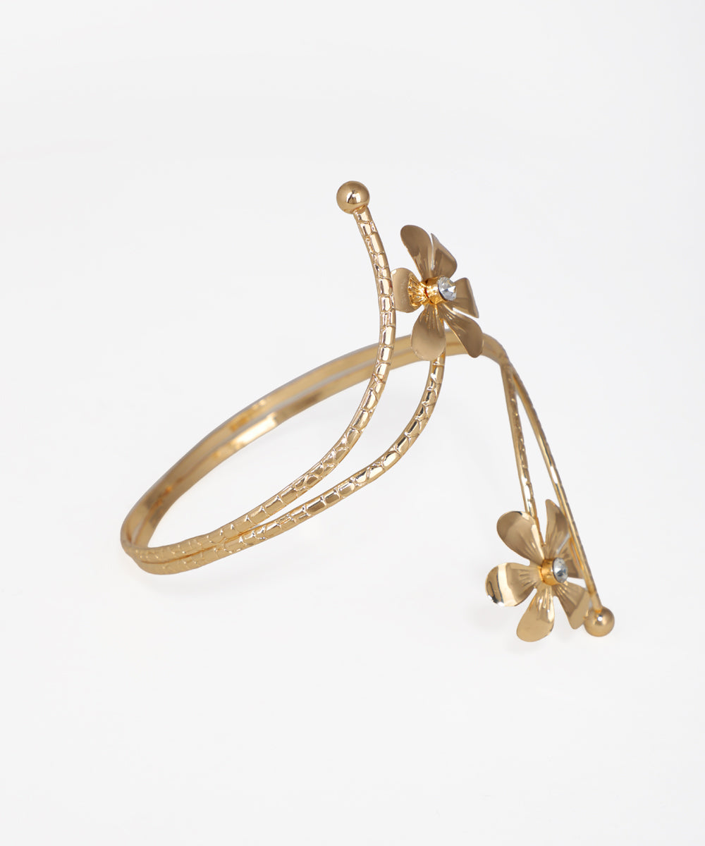 Gold bracelet with butterfly charms on a white background