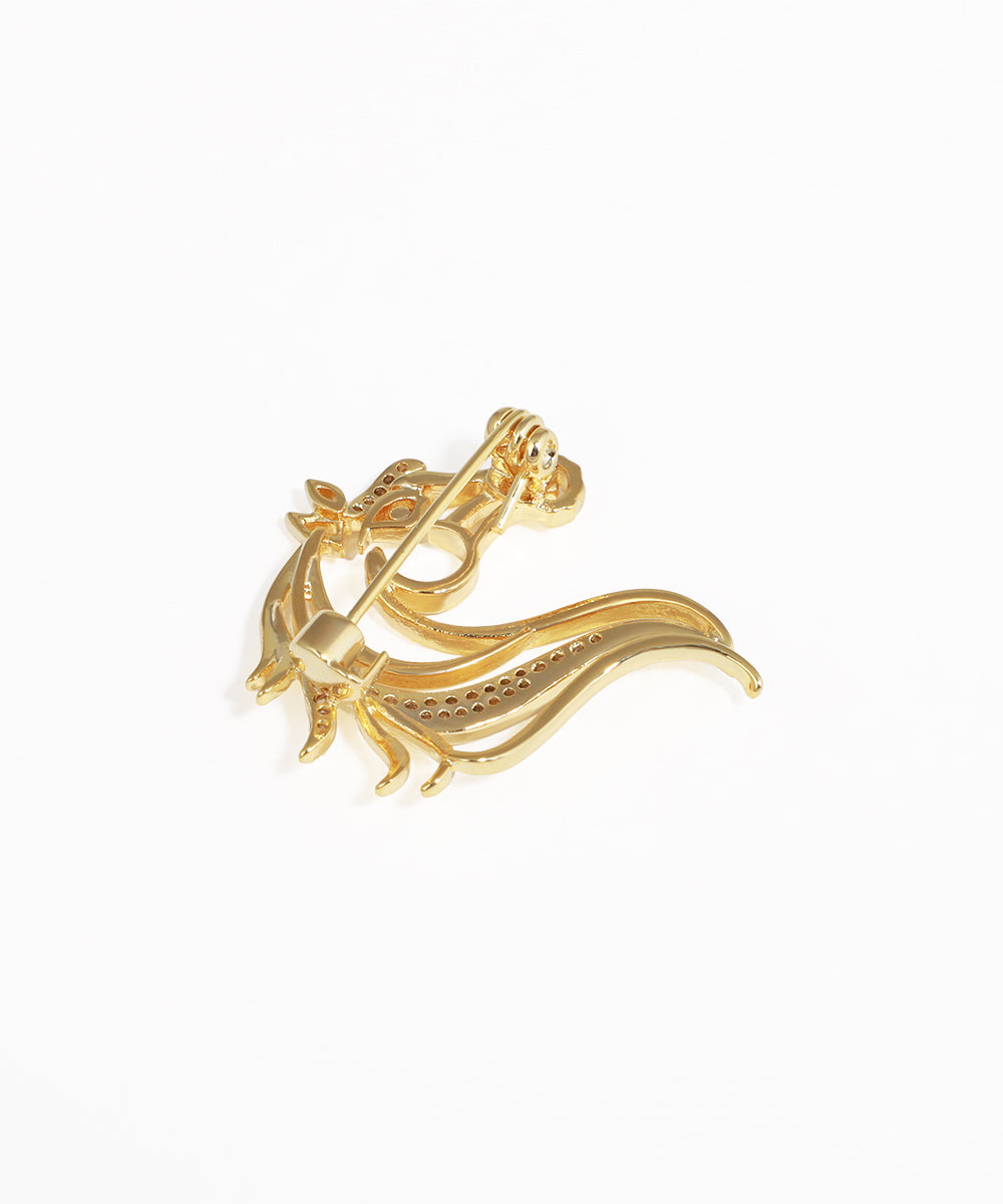 Gold ring with a unique design on a white background