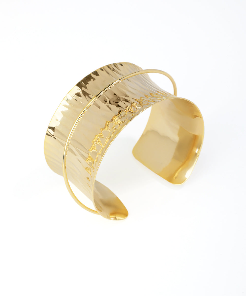Gold bracelet on a white background