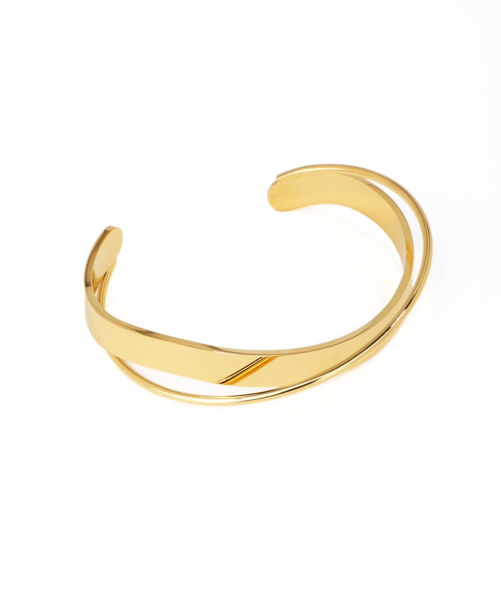 Gold bangle on a white background