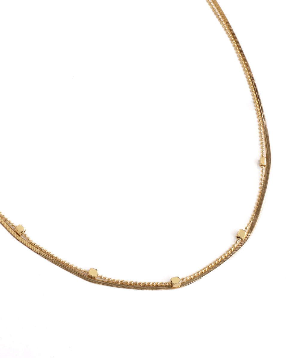 Gold necklace on a white background