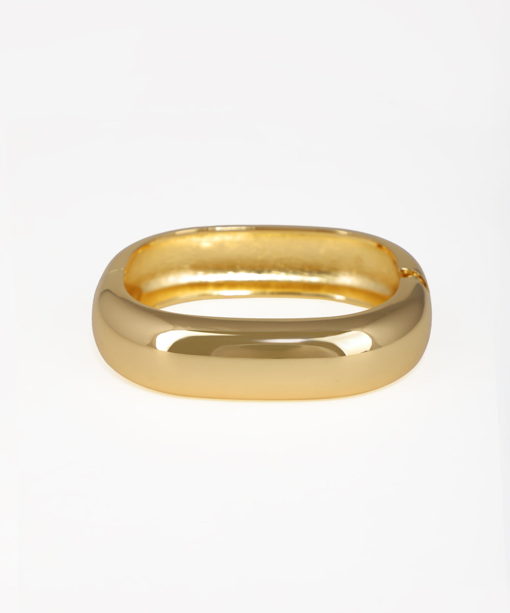 Gold ring on a white background