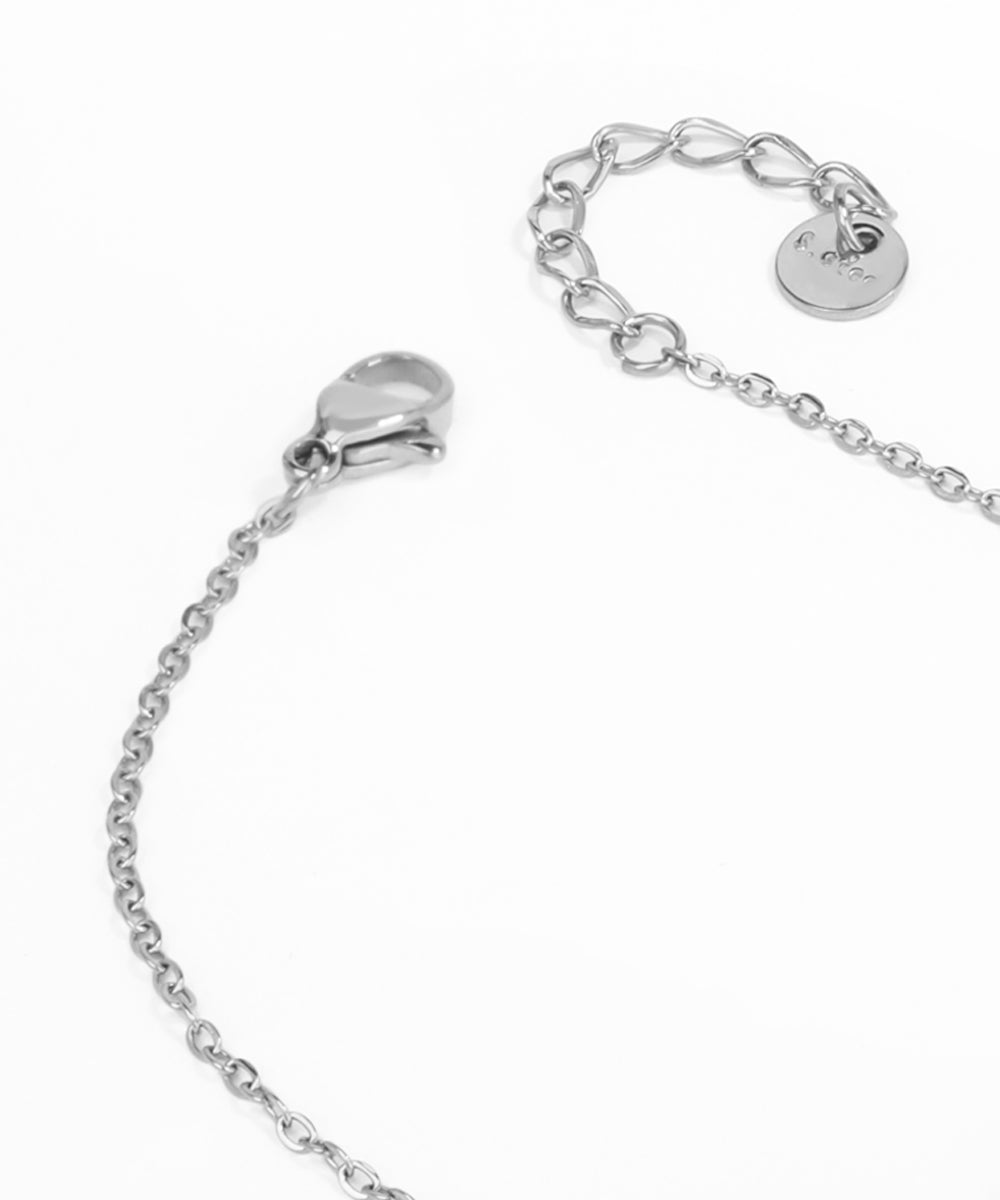 Silver bracelet with a heart padlock clasp on a white background