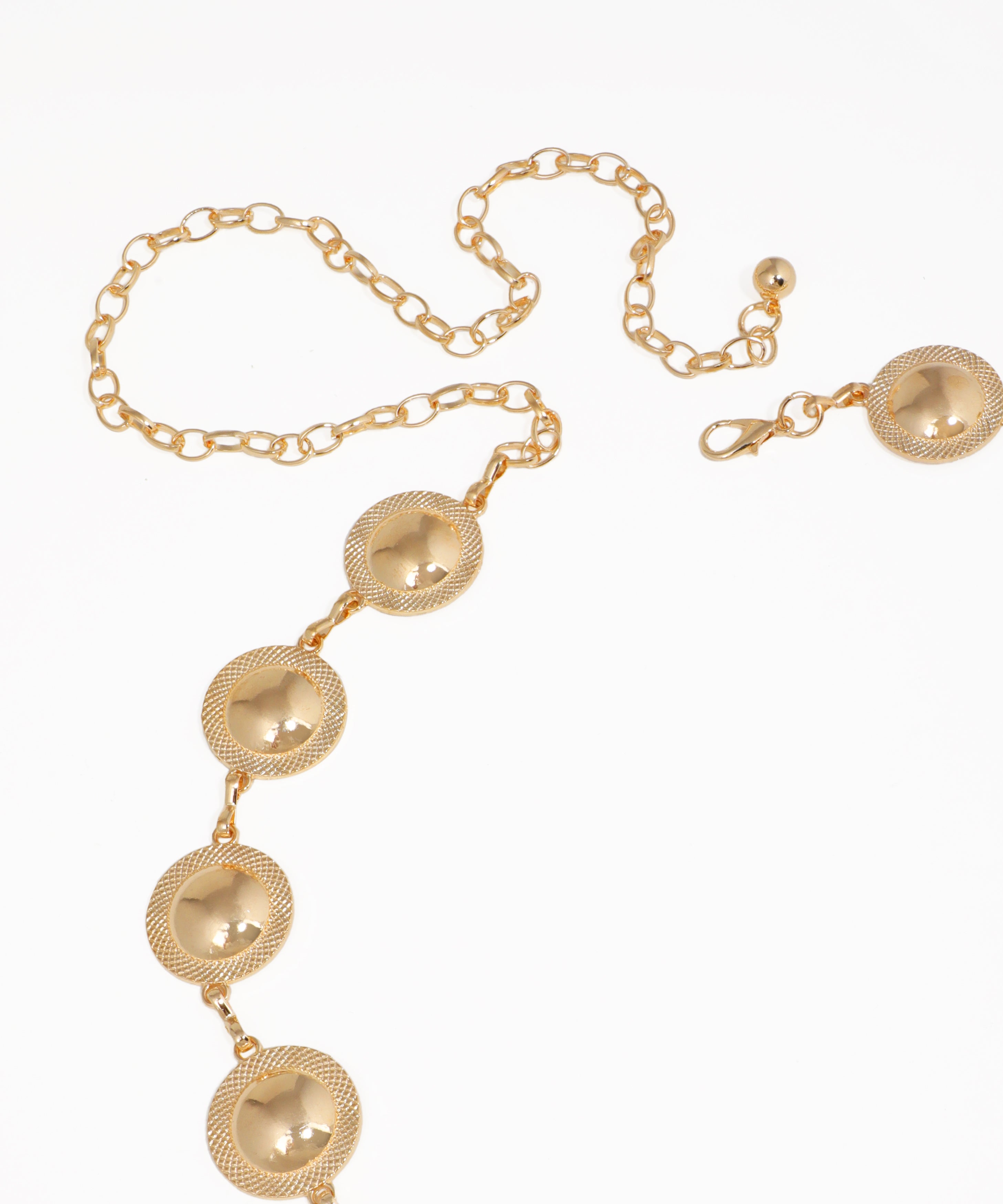 Gold necklace with circular pendants on a white background