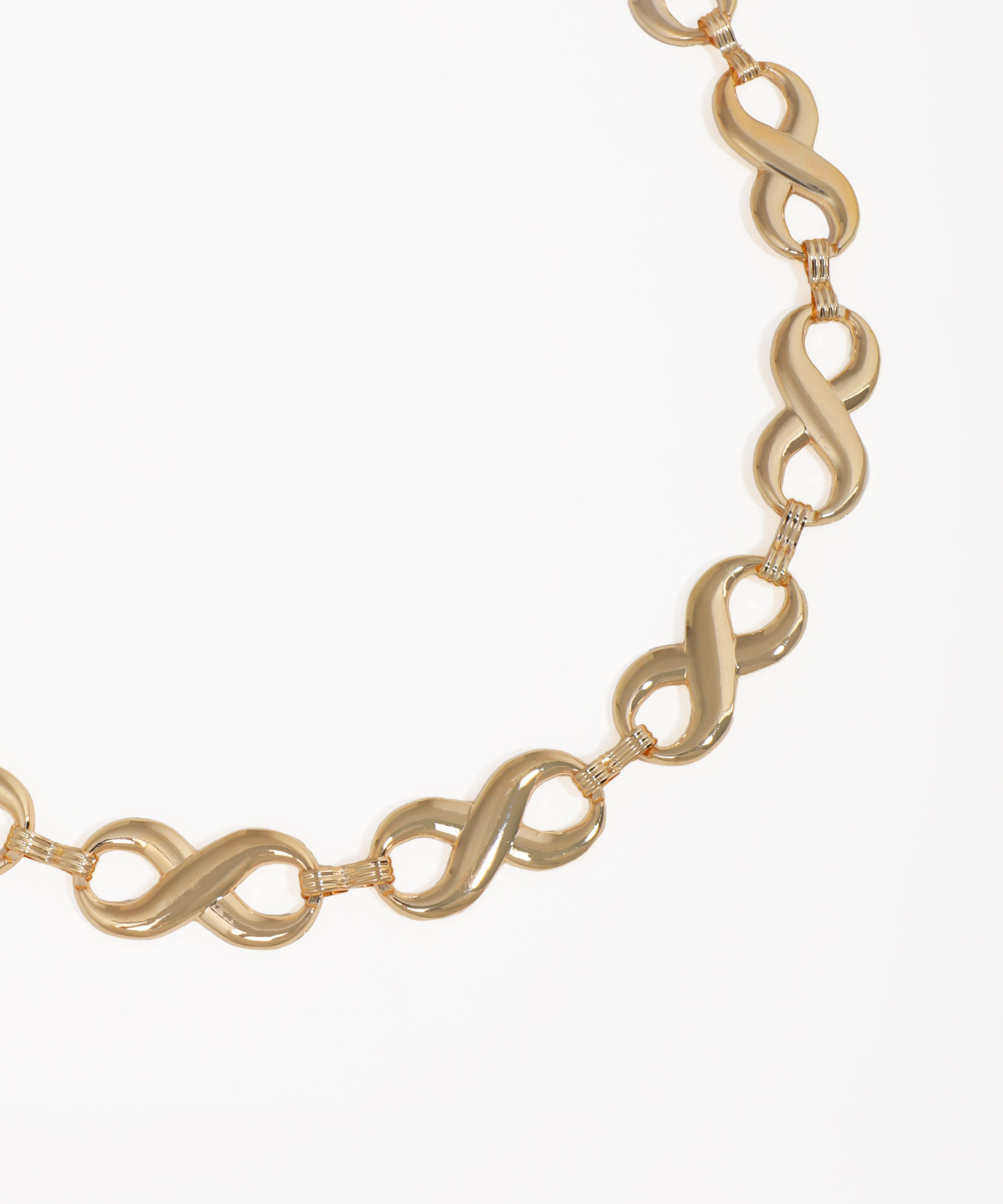 Gold chain necklace on a white background
