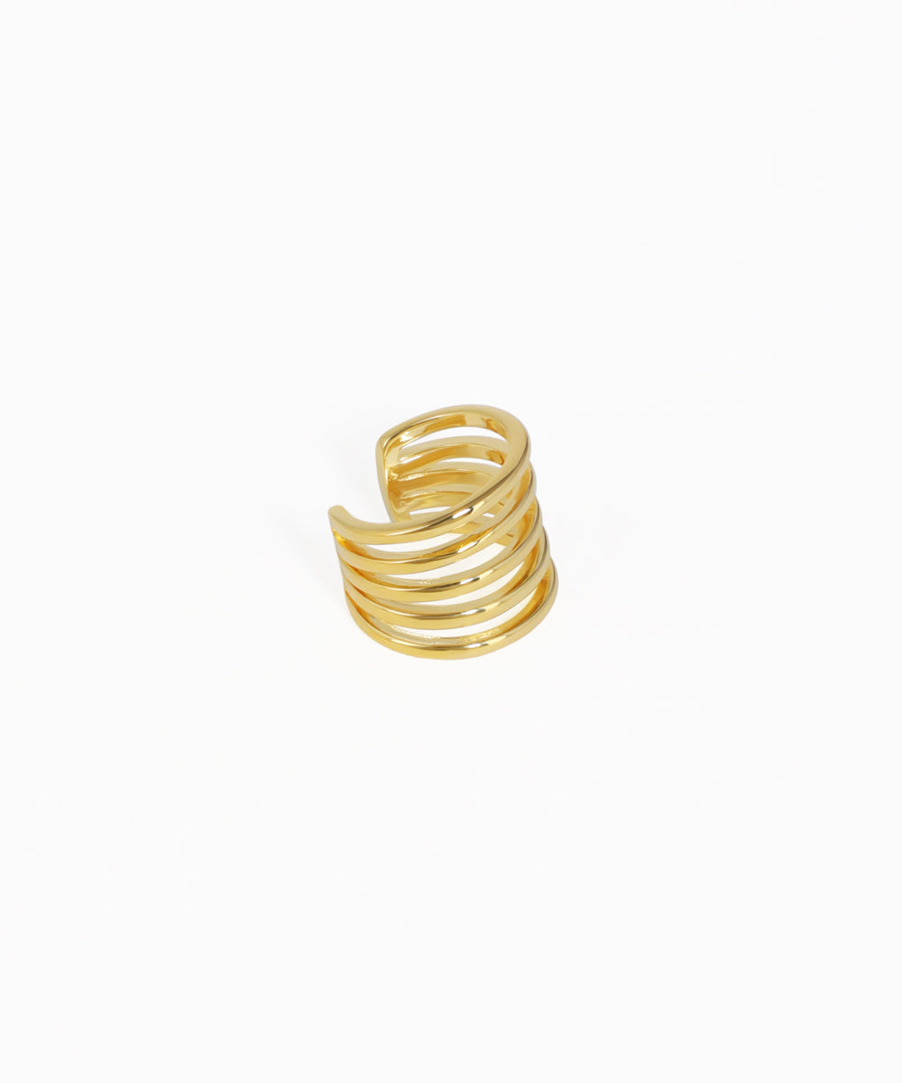 Gold spiral ring on a white background