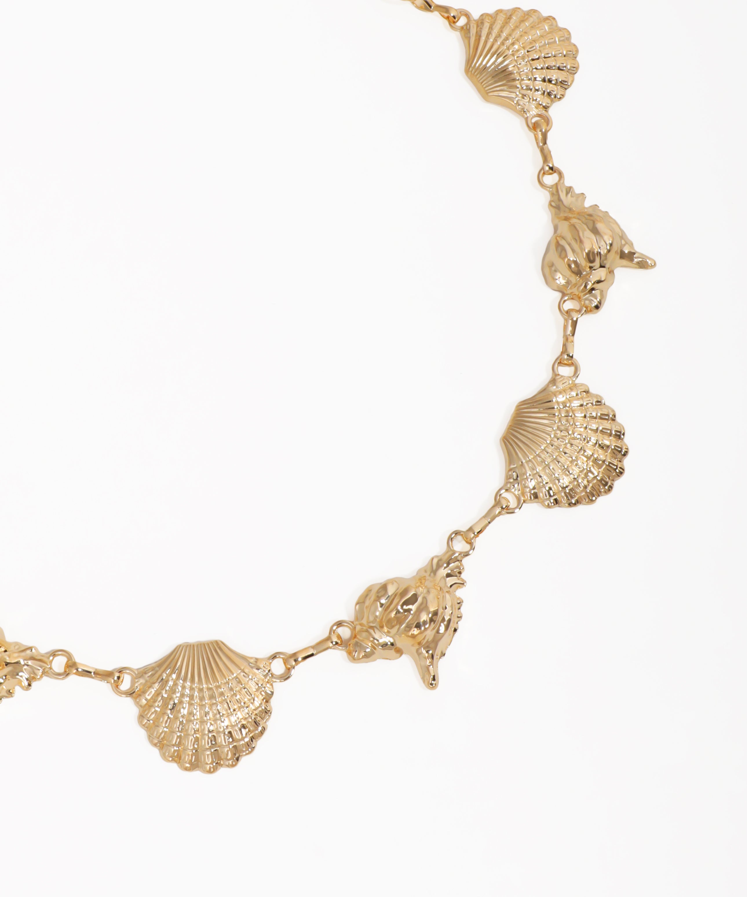 Gold necklace with shell-shaped pendants on a white background