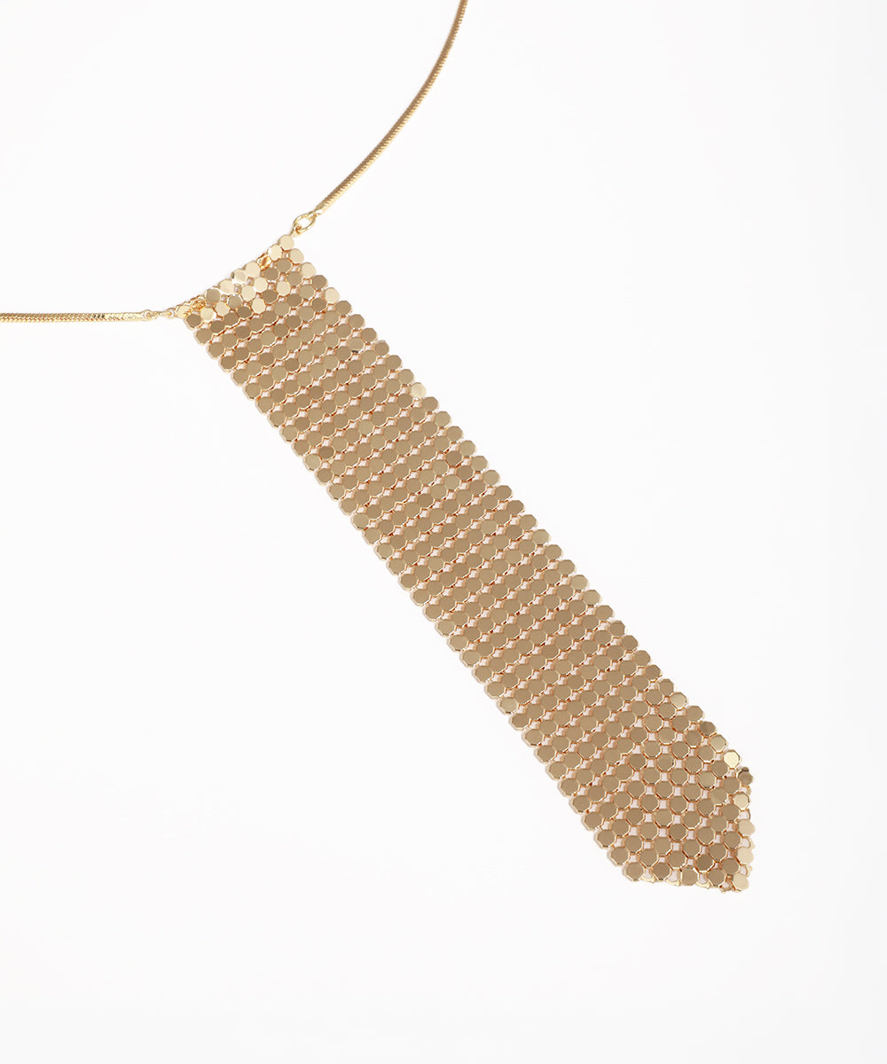 Gold beaded necklace on a white background