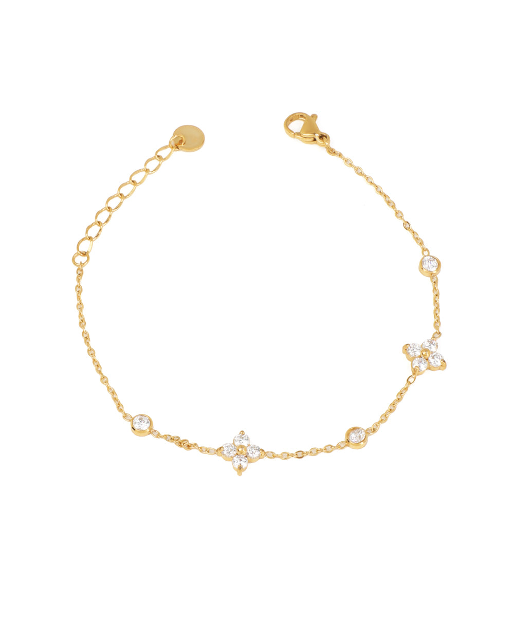 Gold-tone bracelet with delicate chain and sparkle floral clusters, interspersed with single round stones.