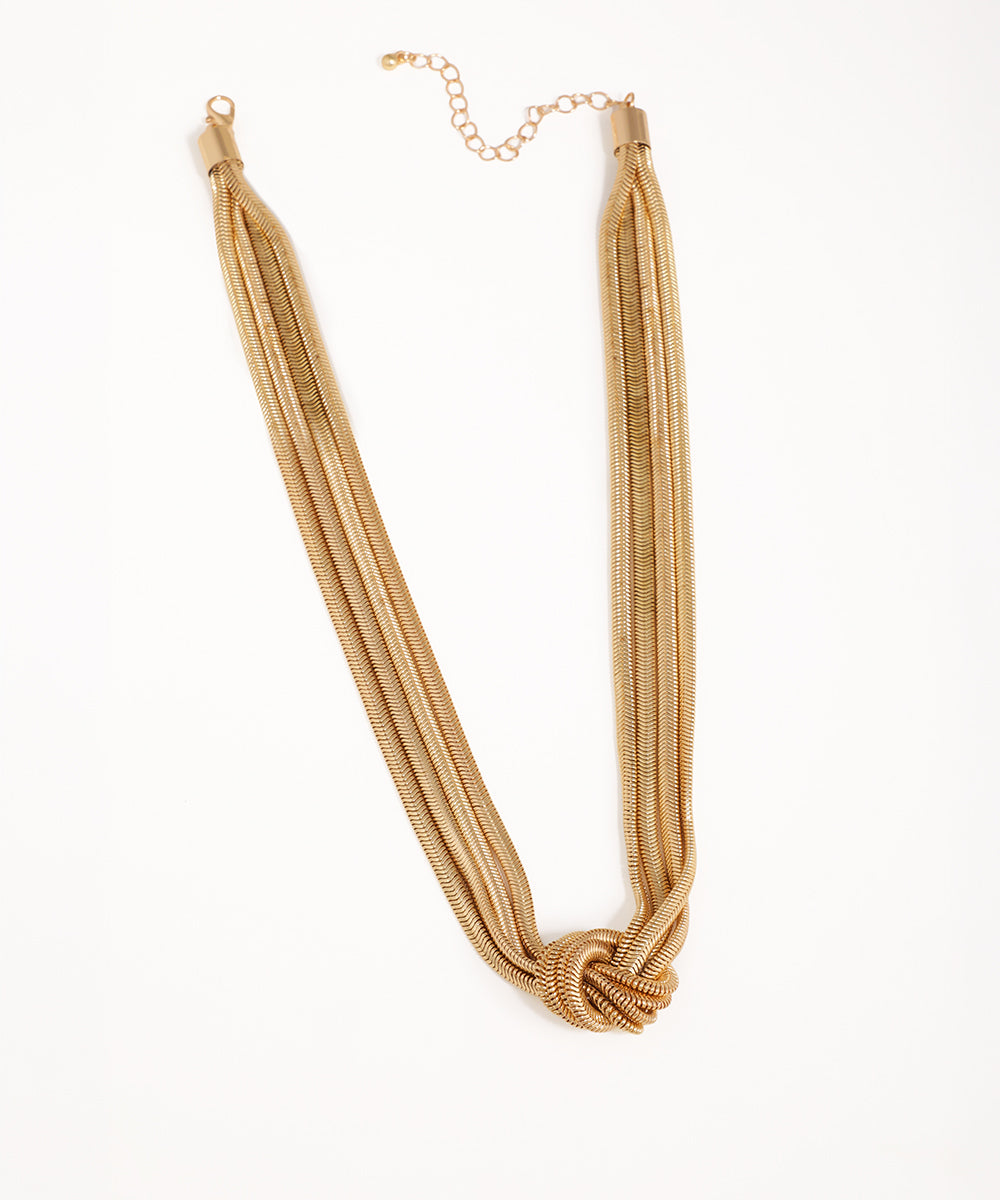 Gold-tone necklace with multiple fluid chains knotted at the center and an extender chain closure.