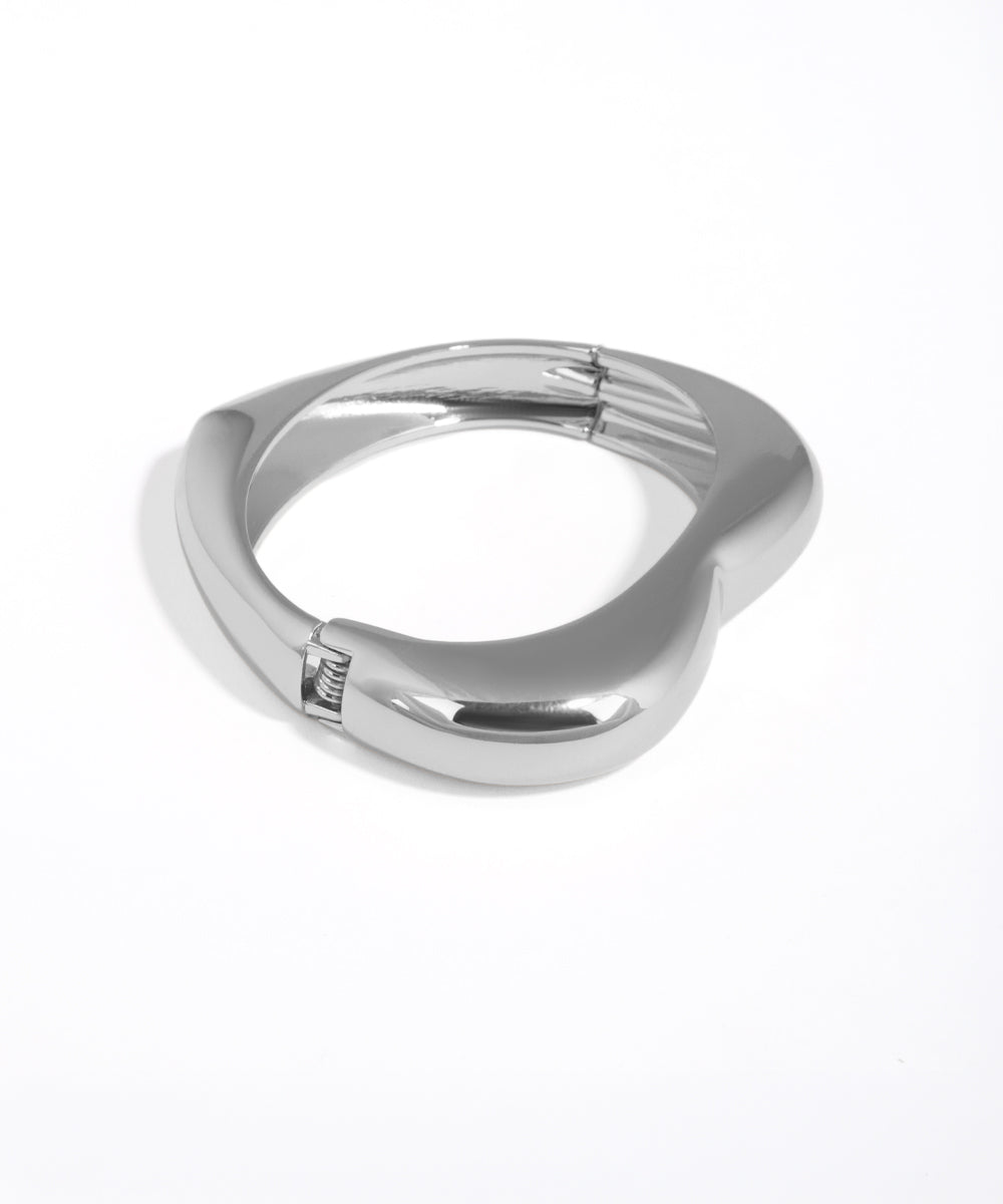 Silver ring with a unique design on a white background