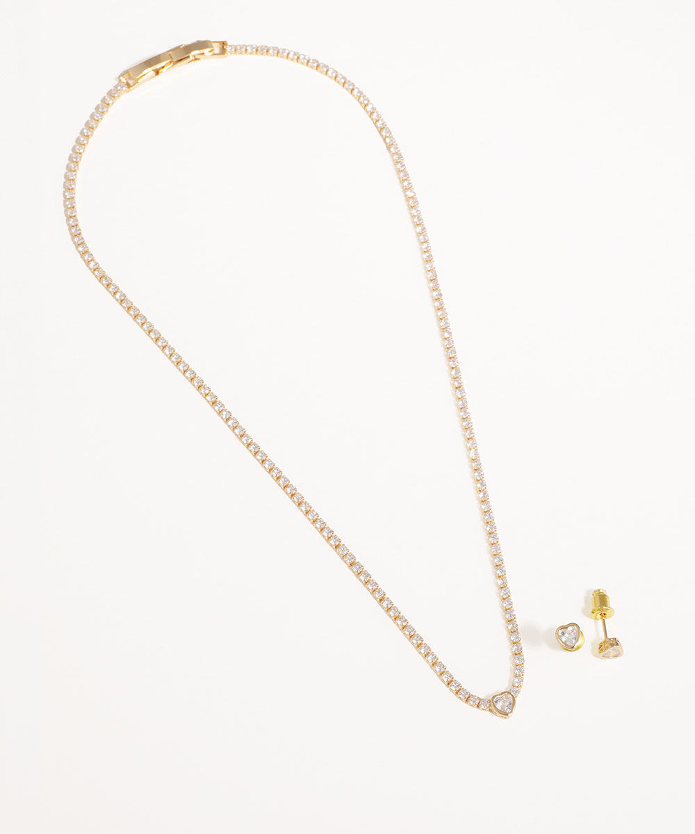 Gold-tone necklace with continuous line of CZ stones and a central heart-shaped pendant