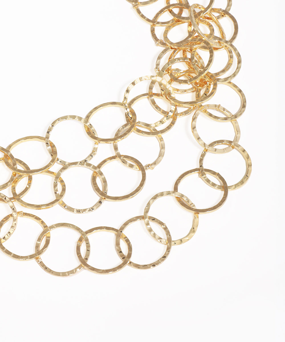 Gold chain necklace on a white background