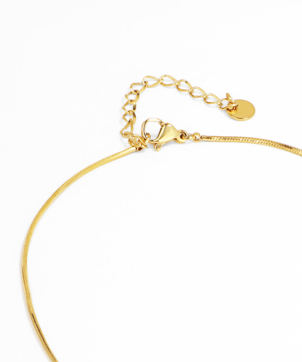Gold necklace on a white background