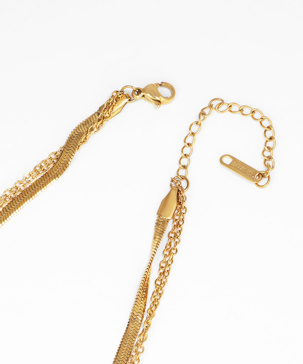 Gold chain necklace on a white background