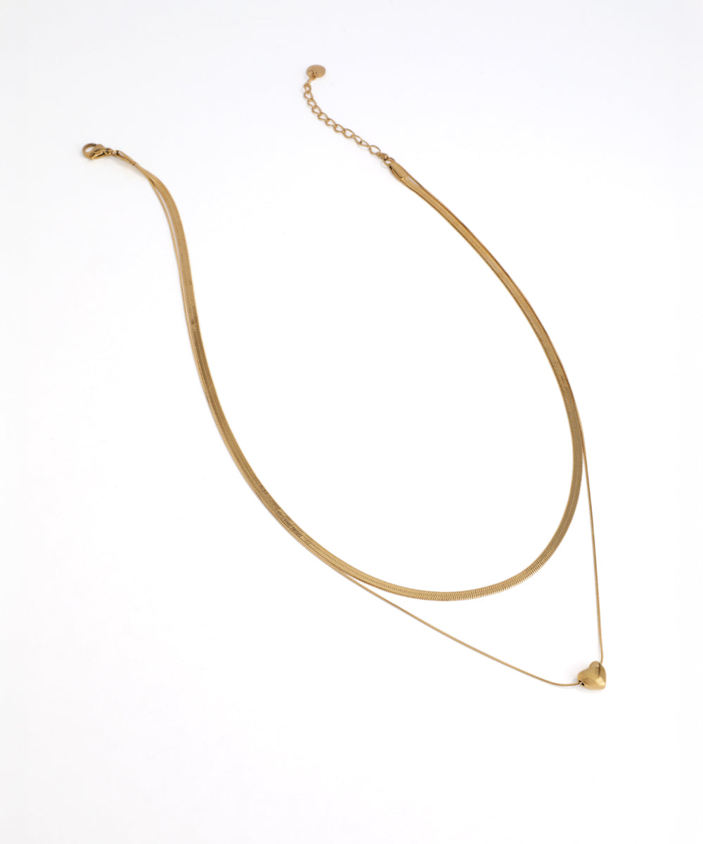 Gold necklace on a white background