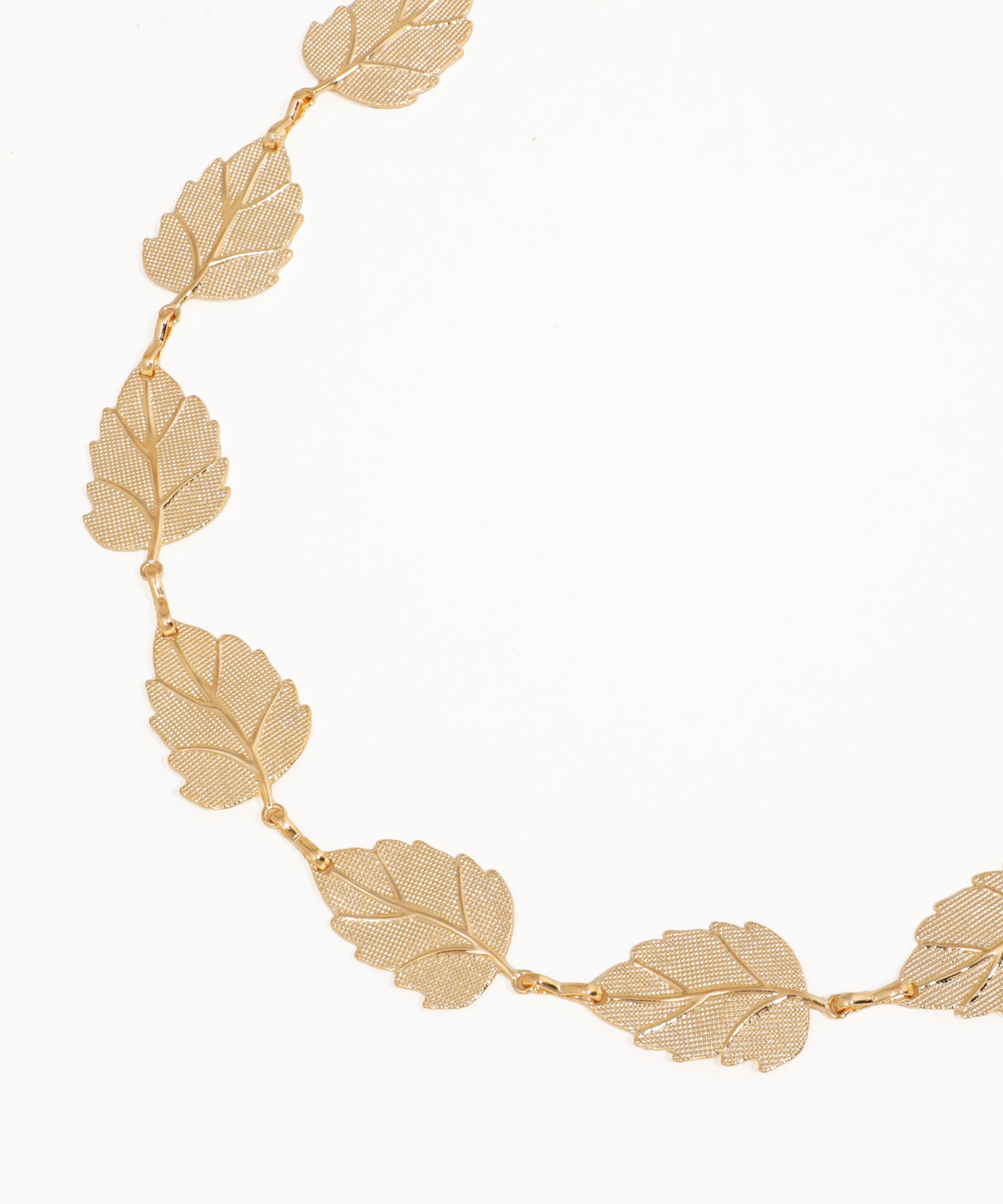 Gold leaf necklace on a white background