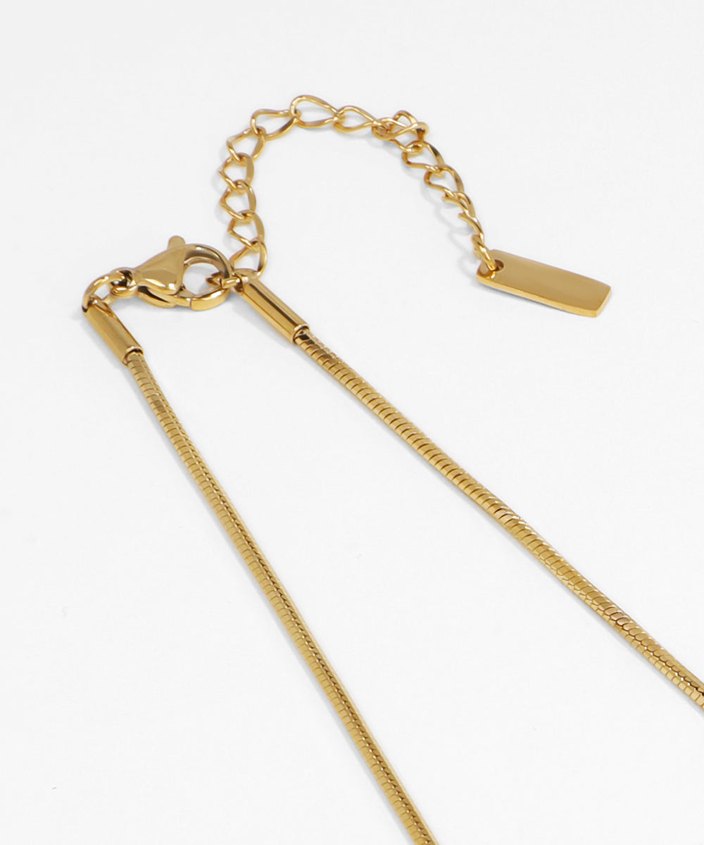Gold chain necklace on a white background