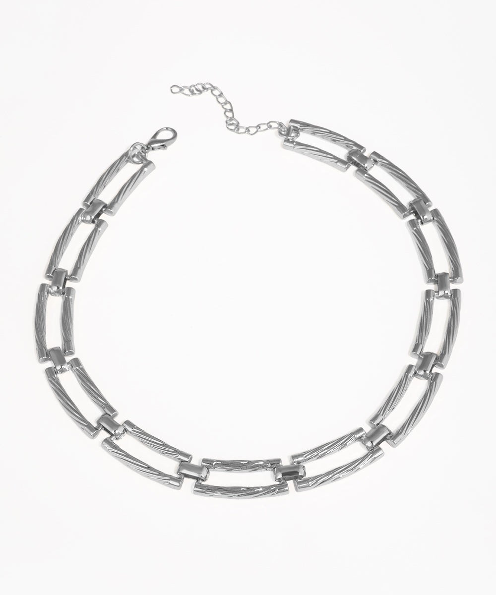 Silver chain necklace on a white background