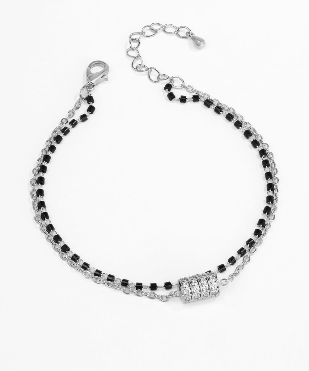 Black and silver beaded bracelet on a white background