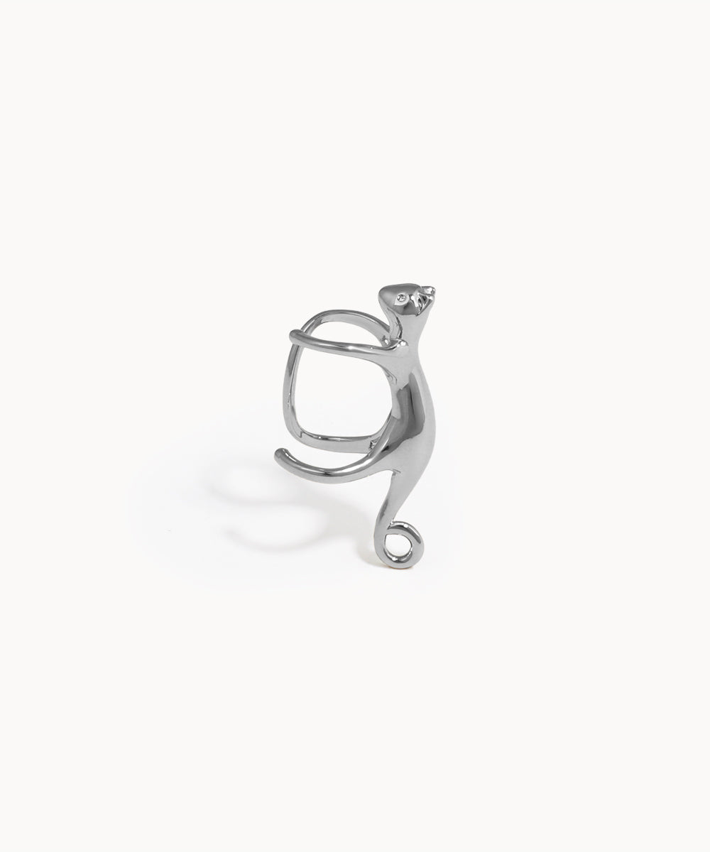 Silver cat-shaped earring on a white background