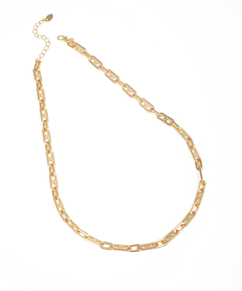 Gold-tone chain necklace with signature pattern on elongated links and lobster clasp