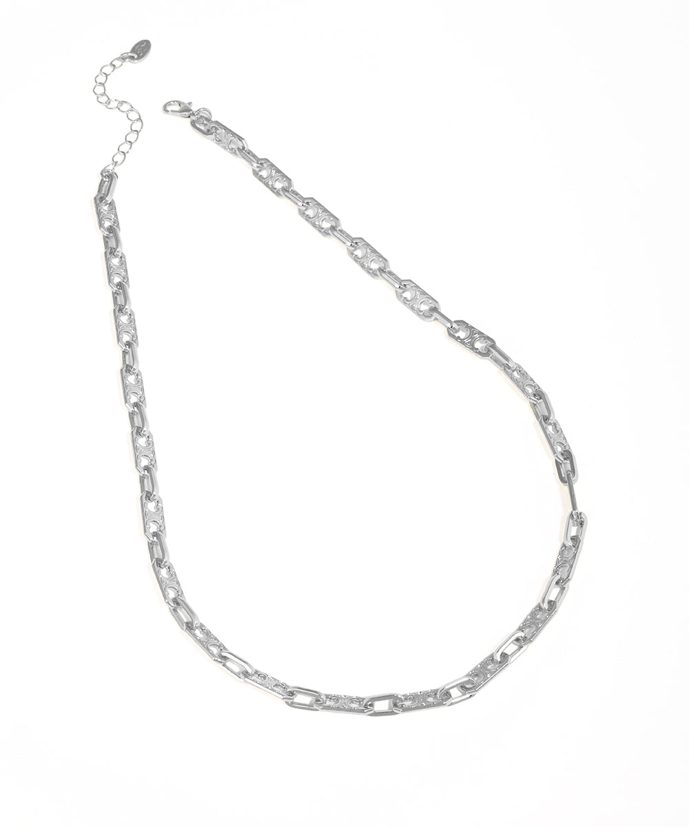 Silver chain necklace on a white background