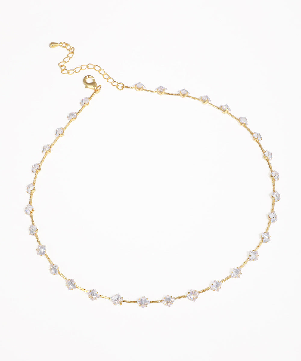 Gold-tone necklace with clear cubic zirconia stones set along the chain