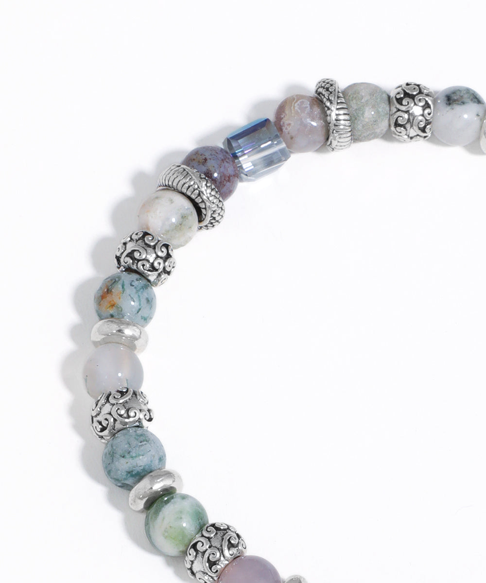 Beaded bracelet with various beads on a white background