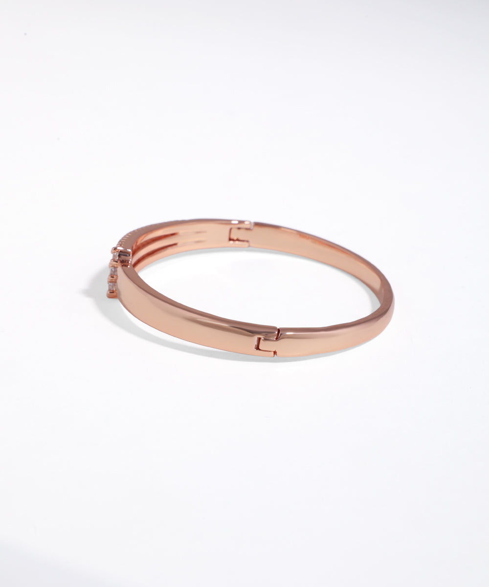 Rose gold bracelet on a white background
