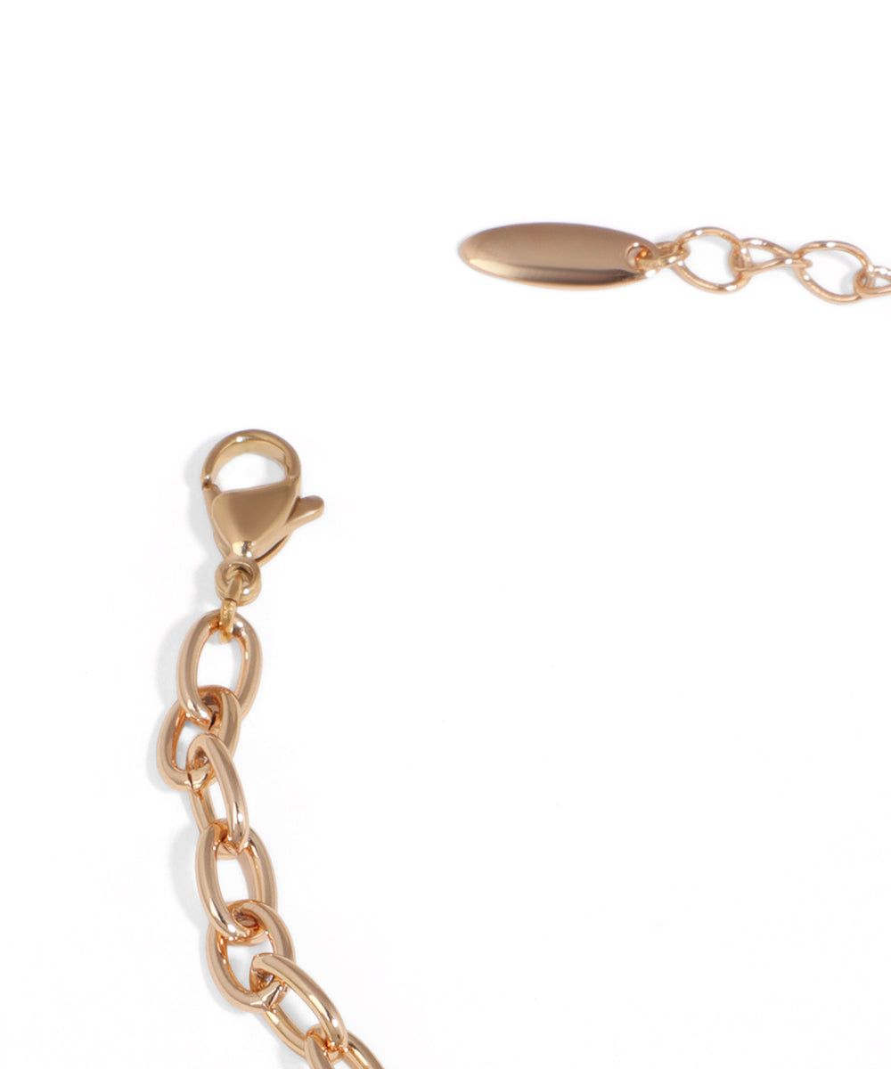 Gold chain bracelet with clasp on a white background