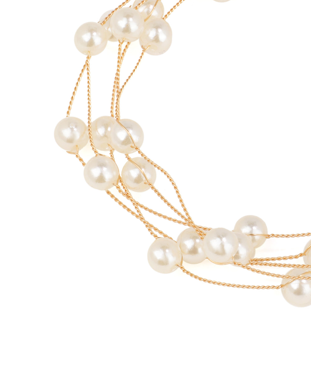 Pearl necklace with gold chain on a white background