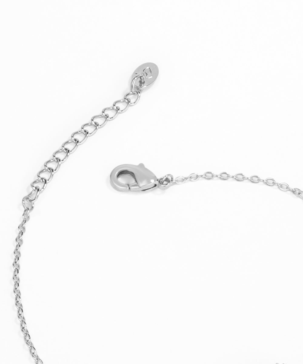 Silver bracelet with clasp on a white background