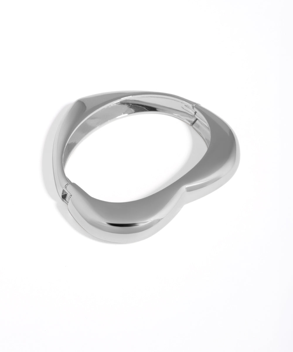 Silver ring with a unique design on a white background