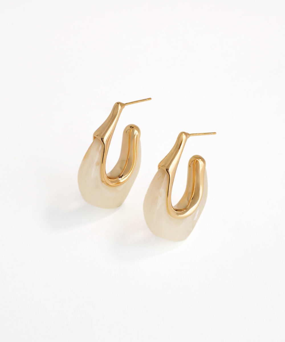 Pair of gold hoop earrings on a white background