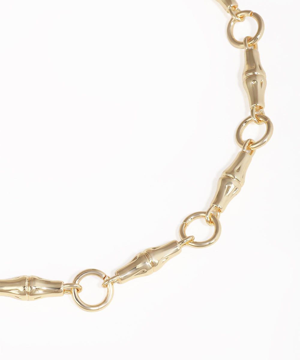 Gold chain bracelet on a white background